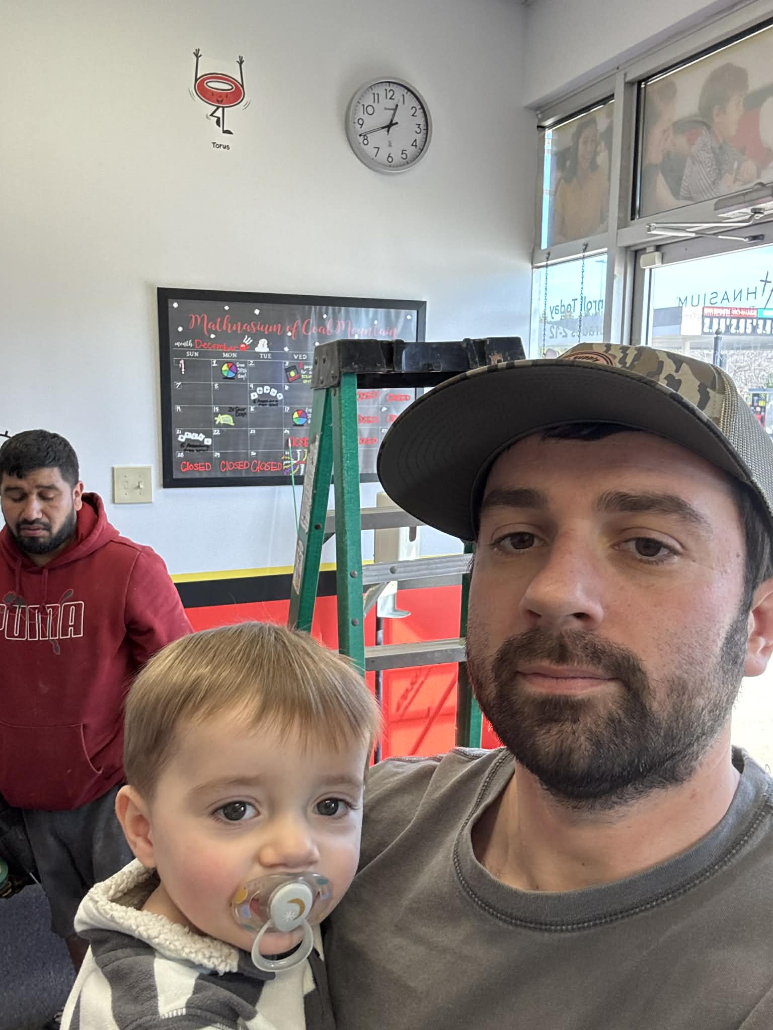 Nick Shapiro of Hot Spot Electrical with his son on a job site